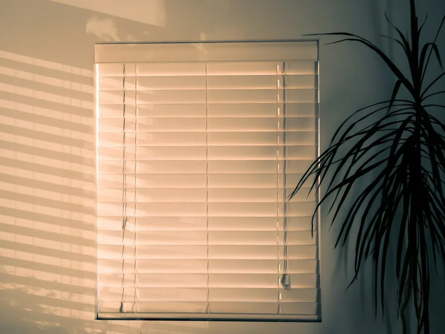 Wooden window blinds in warm light