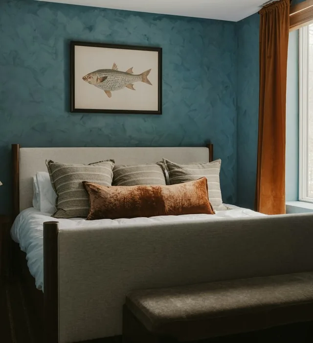 Bedroom with deep blue painted walls