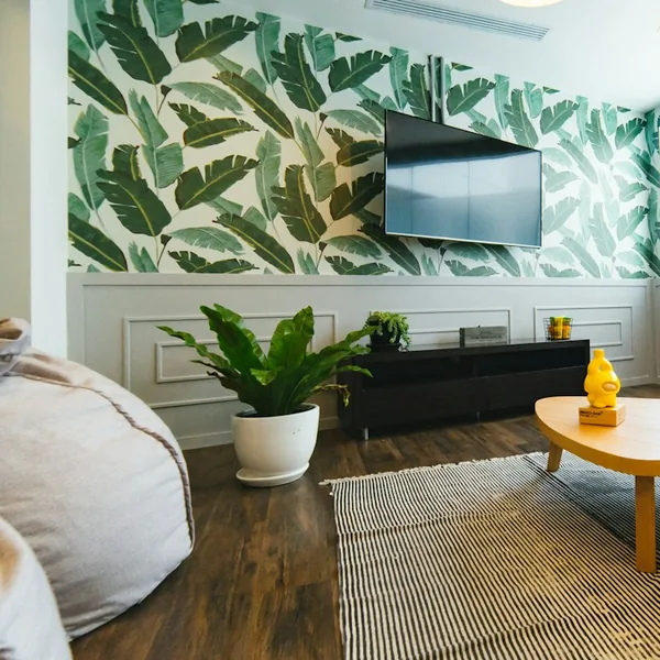 Living room with banana leaf wallpaper